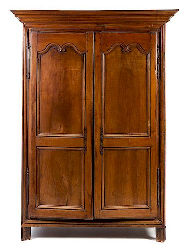 A French Provincial Walnut Armoire Height 78 1/2 x width 51 inches.