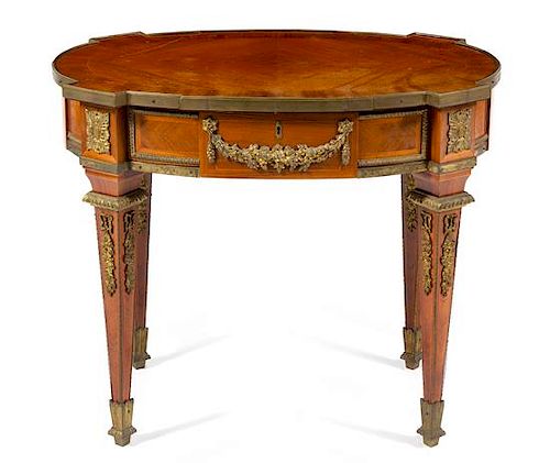 A Louis XVI Style Gilt Metal Mounted Kingwood Table Height 30 1/8 x width 35 5/8 x depth 24 5/8 inches.