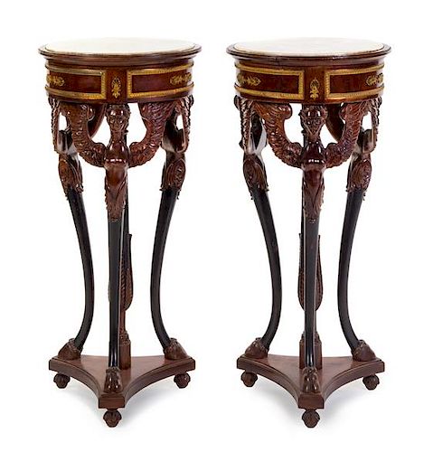 A Pair of Empire Style Gilt Metal Mounted Mahogany Pedestals Height 35 1/2 x diameter of top 17 1/4 inches.