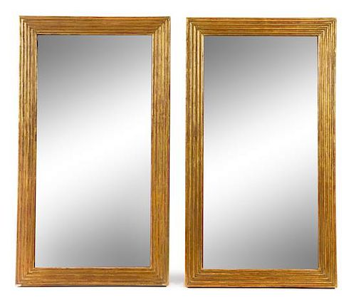 A Pair of Empire Style Giltwood Mirrors Height 48 1/4 x width 27 1/4 inches.