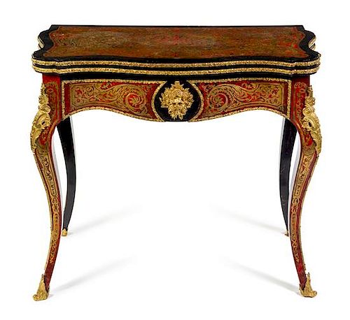 A Napoleon III Gilt Bronze Mounted Boulle Marquetry Flip-Top Table Height 30 1/2 x width 34 x depth 17 inches (closed).