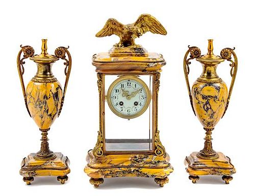 * A French Gilt Metal Mounted Marble Clock Garniture Height of mantel clock 17 1/4 inches.
