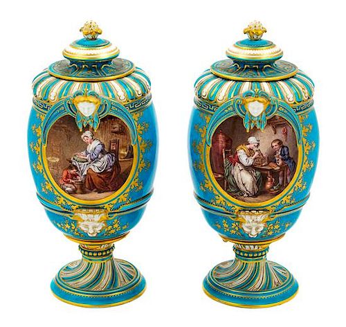 A Pair of Sevres Style Porcelain Urns Height 10 1/2 inches.