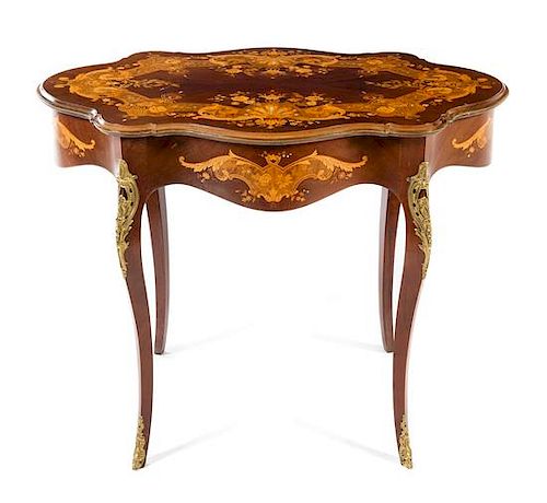 * A French Marquetry and Mother-of-Pearl Inlaid Center Table Height 29 1/4 x width 38 x depth 25 inches.