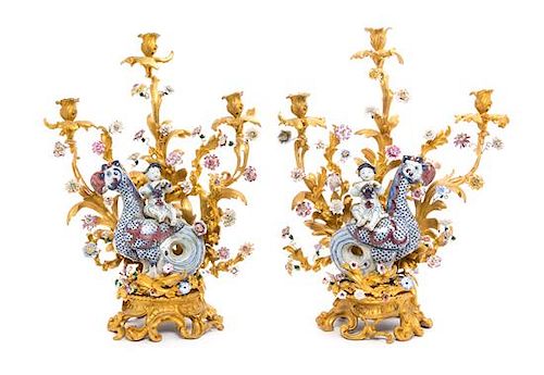 A Pair of Louis XV Style Porcelain Mounted Gilt Bronze Three-Light Candelabra Height 25 1/2 inches.