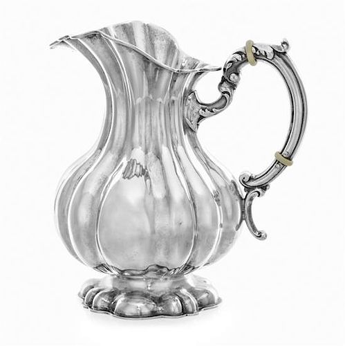 * A Hungarian Silver Water Pitcher, Mid-20th Century, of fluted baluster form, raised on a conforming foot.