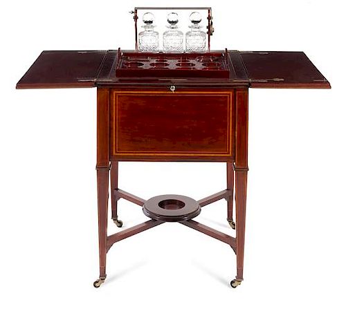 An English Mahogany Drinks Trolley Height 29 3/4 x width 43 3/4 x depth 23 1/2 inches (open).