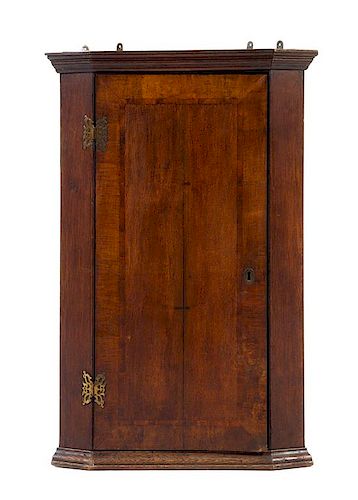 An English Oak Corner Cabinet Height 37 1/2 x width 24 1/2 x depth 13 inches.