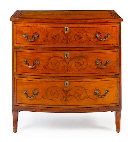 An English Marquetry Chest of Drawers Height 34 1/2 x width 33 1/2 x depth 21 1/2 inches.