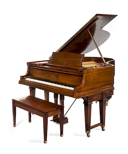 A Steinway & Sons Mahogany Grand Piano Height 40 x width 58 x depth 74 inches.