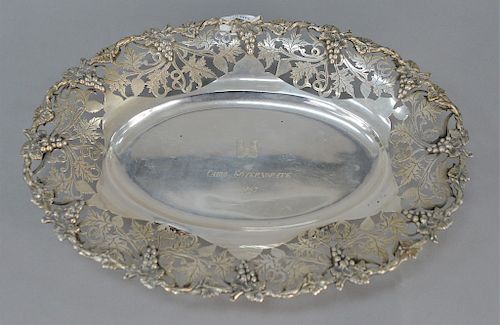 Continental silver oval bowl with reticulated grape and vine border, marked in middle: Cairo Governorate, 1963. 
length 14 1/4 in. 
...