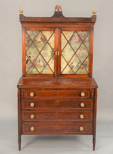 Sheraton mahogany secretary desk in two parts with line inlays, glass shelves, and flip lid, circa 1830. 
height 64 in., width 42 in.