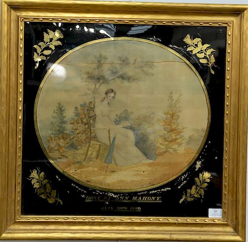 Silk needlework and watercolor of girl in chair having book with black and gilt reverse painted surround, marked: Done by Ann Mahony...