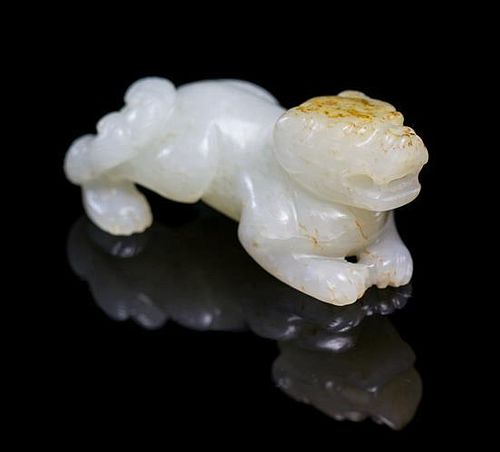 A Jade Figure of a Temple Lion Width 2 1/4 inches.