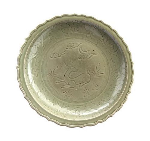 A Longquan Celadon Glazed Porcelain Charger Diameter 18 3/4 inches.