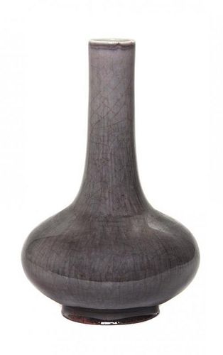 * An Aubergine Flambe Glaze Bottle Vase Height 8 1/4 inches.