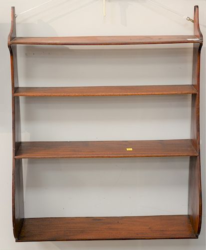 Mahogany hanging shelf, 19th century. 
height 33 in., width 26 1/4 in.
