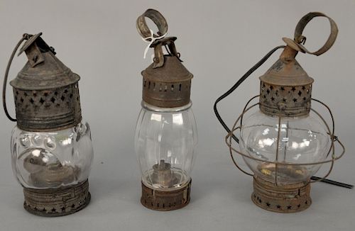Three early lanterns, two with molded glass, one with ball glass electrified. 
heights 9 in., 9 in., & 10 in.