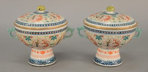 Pair of Chinese porcelain covered compotes having panels painted with five claw dragon and phoenix bird, opening to removable fitted...