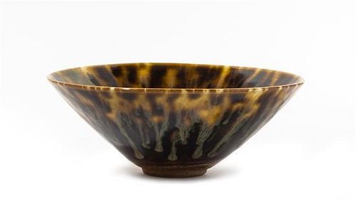 * A Brown Glazed Stoneware Tea Bowl Diameter 6 1/4 inches.