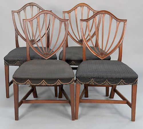 Set of four of Federal side chairs having shield backs with over upholstered seats, set on molded legs with H stretchers, probably M...