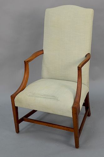 Federal mahogany upholstered chair with open arms on square tapered legs and stretchers, circa 1800. 
seat height 17 in., total heig...