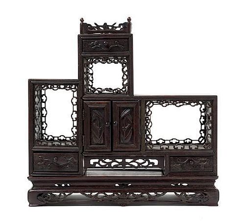 A Carved Hardwood Display Etagere Height 14 1/2 x width 14 1/8 inches.
