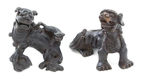 Two Bronze Lion-Form Scroll Weights Height of taller 2 1/4 inches.