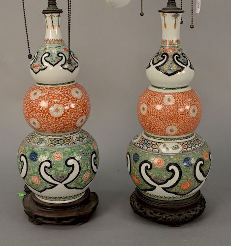Pair of Chinese famille verte triple gourd porcelain vases having painted scrolling vines, flowers, and butterflies, made into table...
