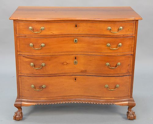 Cherry serpentine chest having serpentine top over four conforming drawers, all set on cabriole legs with ball and claw feet and gad...