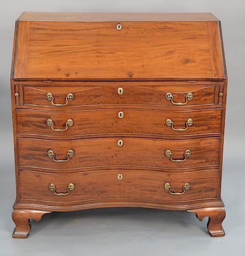 Chippendale mahogany desk with slant lid over four oxbow drawers set on ogee feet. 
height 43 1/2 in., case width 42 in.