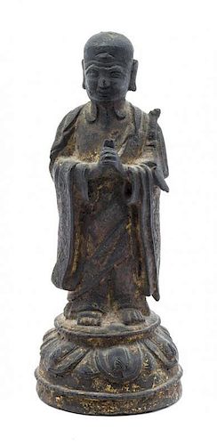 * A Bronze Figure of a Luohan Height 7 1/4 x width 3 inches.