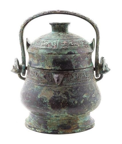 An Archaistic Bronze Ritual Wine Vessel and Cover, You Height 11 1/2 inches.
