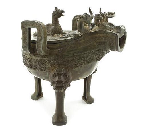 A Warring States Style Cast Bronze Zoomorphic Lidded Censer Height 8 3/8 inches.