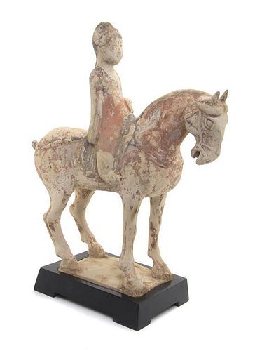 * A Pottery Horse and Rider Height 13 1/4 inches.