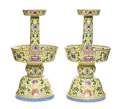 A Pair of Famille Jaune Porcelain Candlesticks Height 10 1/2 inches (each).
