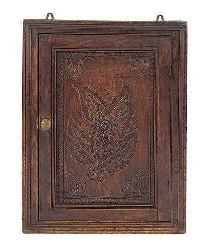 A George I Hanging Cupboard, Height 24 1/2 x width 18 5/8 x depth 9 1/4 inches.
