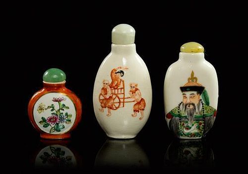 * A Group of Three Porcelain Snuff Bottles Height of tallest 3 1/4 inches.