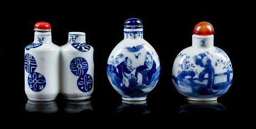 A Group of Three Blue and White Porcelain Snuff Bottles Height of tallest 2 3/8 inches.