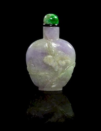 * A Carved Jadeite Snuff Bottle Height 2 1/8 inches.