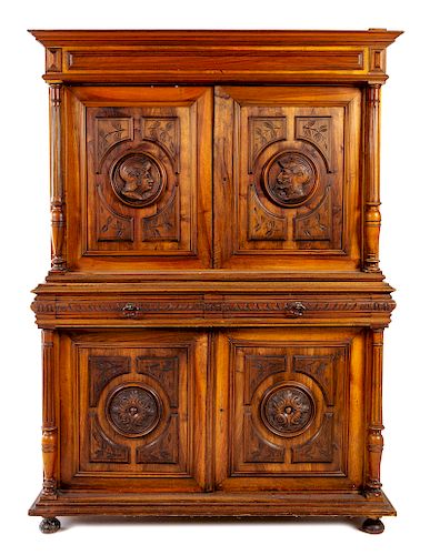 A Continental Carved Walnut Court Cupboard Height 76 x width 84 x depth 21 inches.