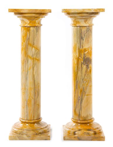A Pair of Marble Pedestals Height 43 1/2 inches.