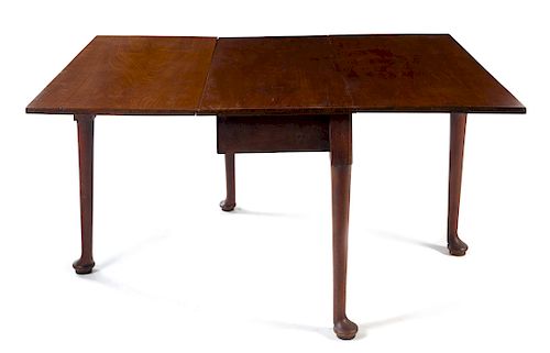 A Queen Anne Mahogany Drop-Leaf Table Height 28 1/8 x width 43 5/8 x depth 19 3/4 inches (closed).