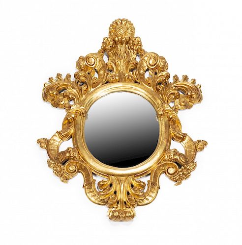 Large round mirror with frame in carved and gilt wood, 20th Gran espejo circular con marco en madera tallada y dorada, 
