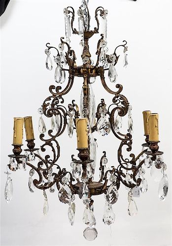A Gilt Metal and Glass Six-Light Chandelier Height 37 x diameter 26 inches.