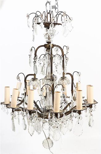 A Gilt Metal and Glass Twelve-Light Chandelier Height 33 1/2 x diameter 24 inches.