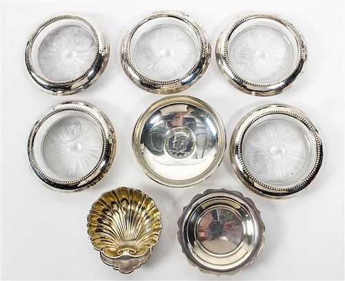 * A Group of Eight American Silver Table Articles, Various Makers, comprising five silver lined glass ash trays and three nut di