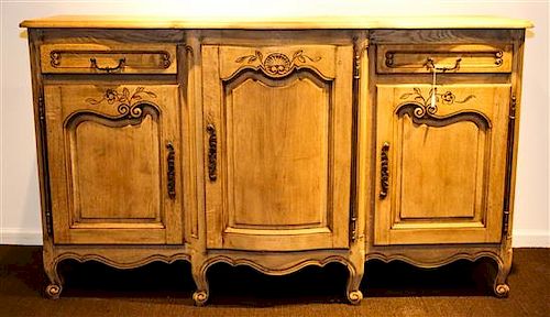 A Louis XV Style Provincial Sideboard Height 39 1/4 x width 67 1/2 x depth 20 inches.
