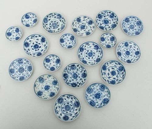 SET OF THIRTEEN CHINESE BLUE AND WHITE PORCELAIN FOOTED SAUCE DISHES AND FIVE SIMILAR SMALLER DISHES