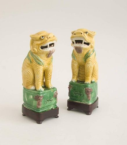 PAIR OF CHINESE GLAZED BISCUIT FIGURES OF SEATED FU DOGS